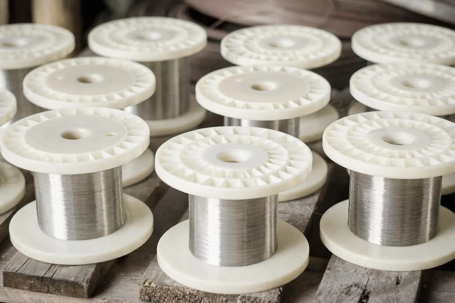 Arialloy manufactured nickel alloy fine wire grouped wire spools on table