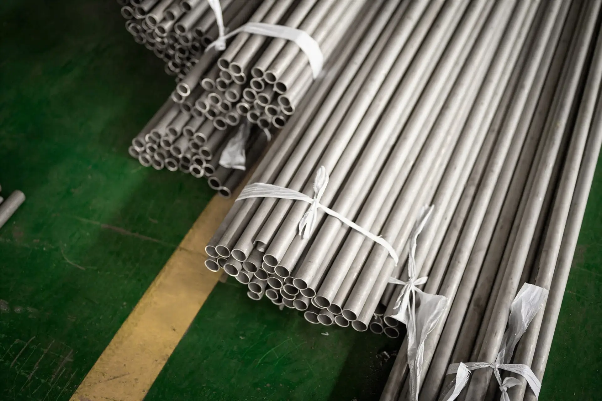 Arialloy nickel alloy seamless tube fabrication strapped tube bundles on floor
