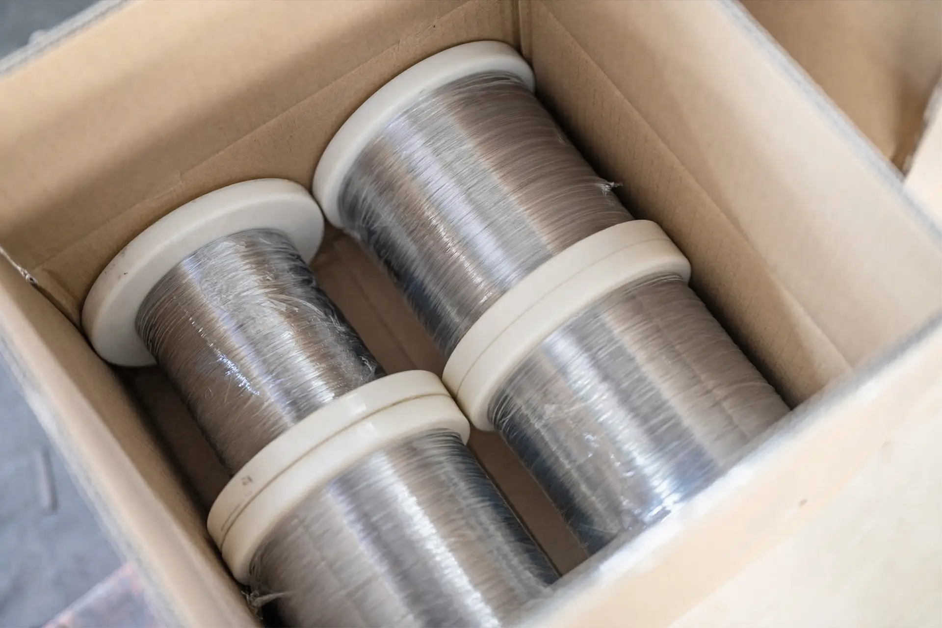 nickel alloy fine wire by Arialloy wire spools in padded box