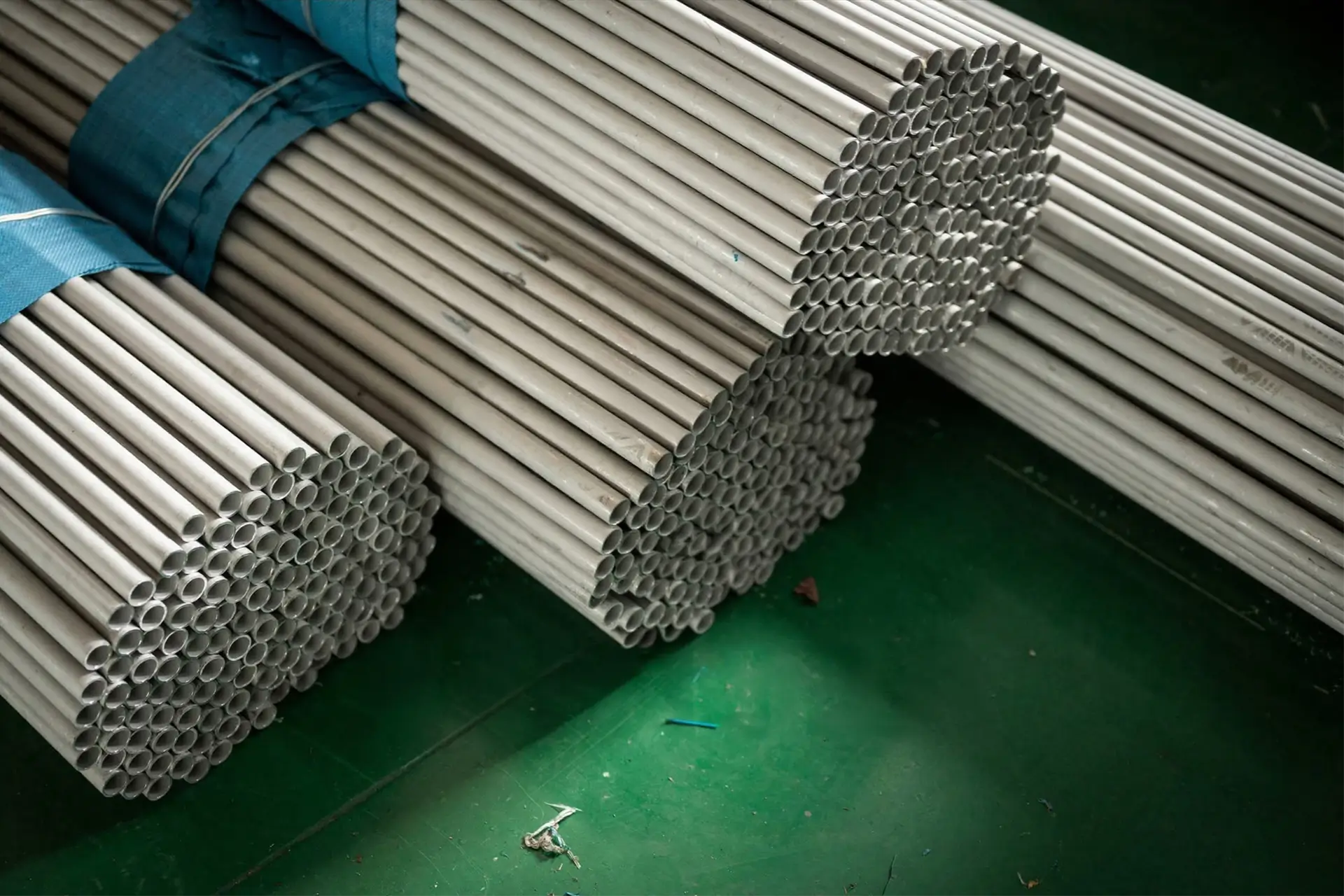 seamless pipe nickel alloy fabrication services Arialloy stacked tube bundles on floor
